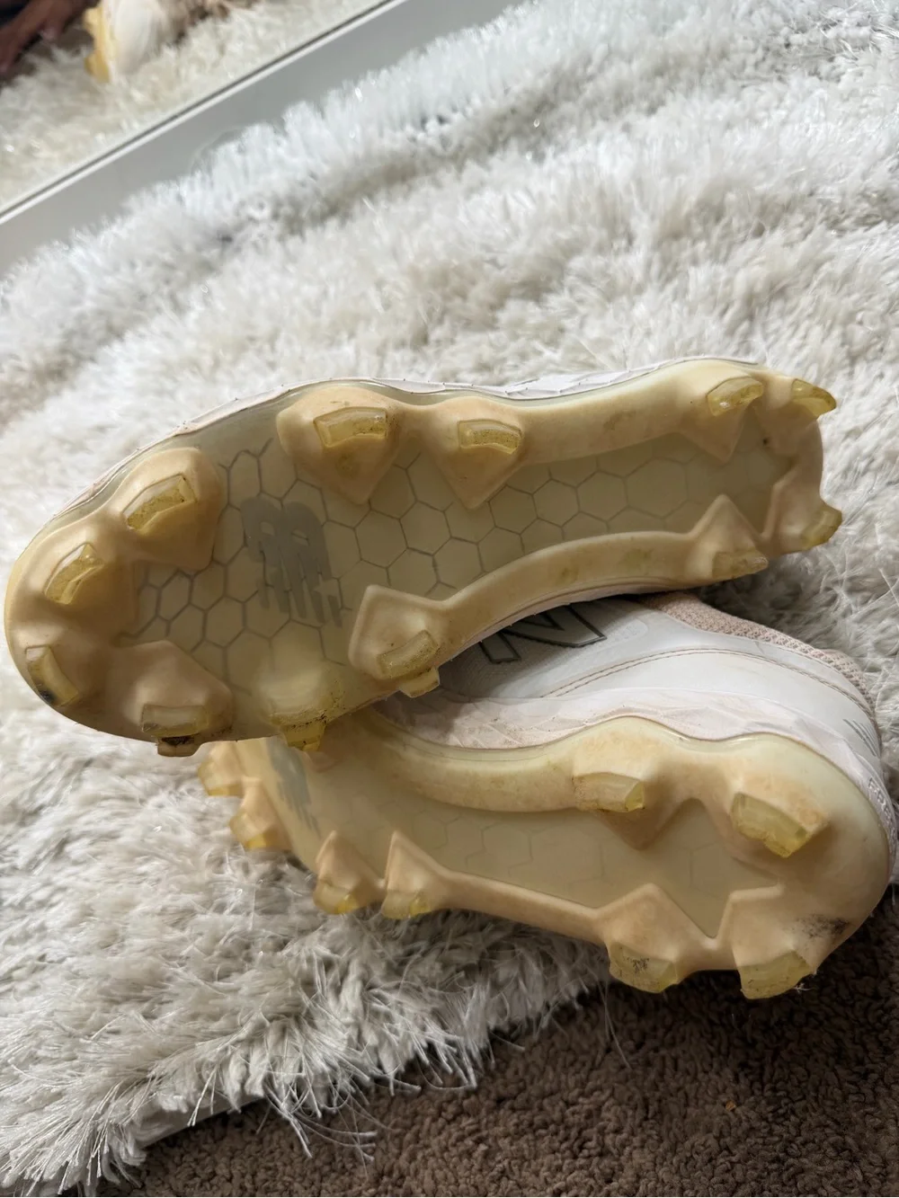 New Balance womens White and Beige Cleats